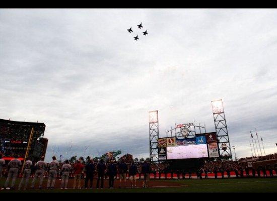 SAN FRANCISCO - OCTOBER 27: A giant American flag is displayed on the field as jets perform a fly over before Game One of the 2010 MLB World Series against the San Francisco Giants at AT&T Park on October 27, 2010 in San Francisco, California...